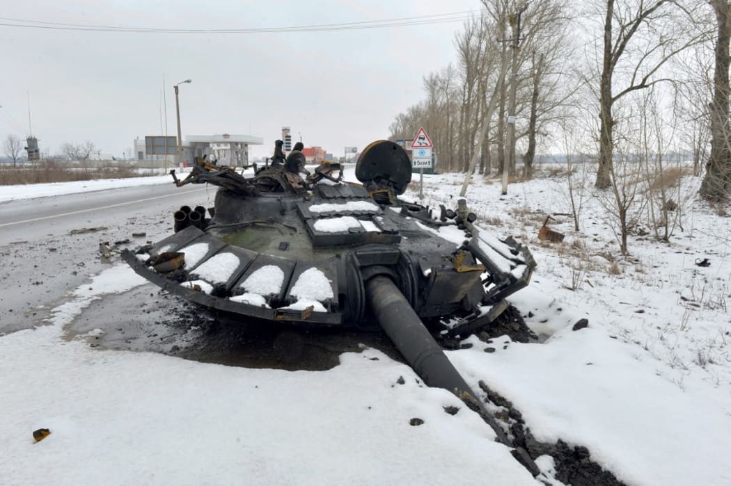 A fragment of a destroyed Russian tank is seen on the roadside on the outskirts of Kharkiv on February 26, 2022, following the Russian invasion.