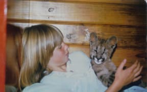 Kirsty Willis with a young lion.