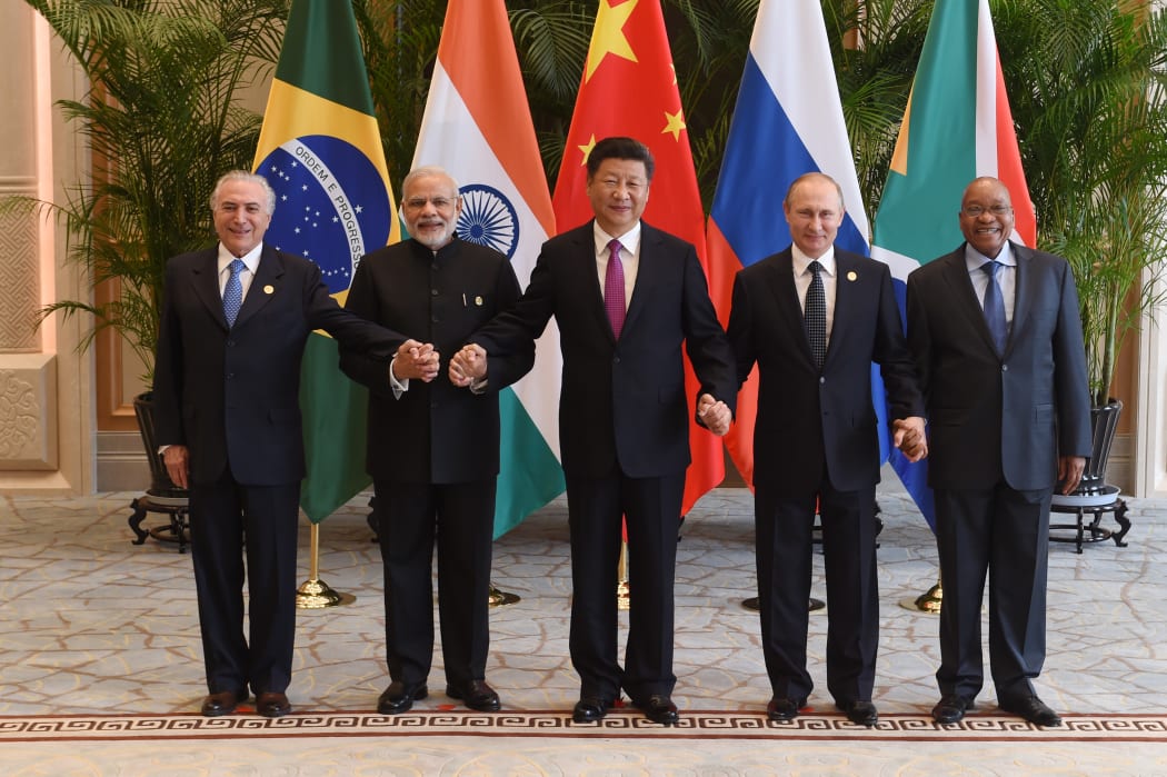 Brazil's President Michel Temer poses with India Prime Minister Narendra Modi, China President Xi Jinping,  Russian President Vladimir Putin and South Africa President Jacob Zuma (R) for a group photo at the West Lake State Guest House in Hangzhou.