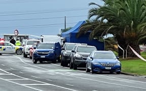 Police cars outside the scene of a double homicide in Ruakākā on 15 May, 2023.