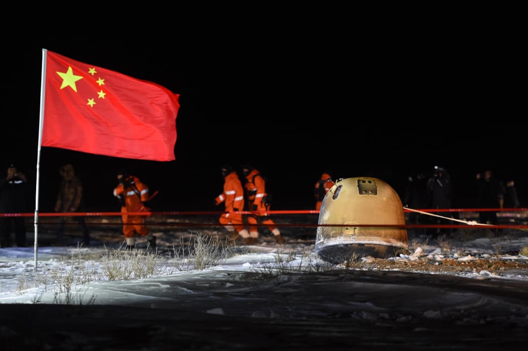 The return capsule of China's Chang'e-5 probe lands in Siziwang Banner, north China's Inner Mongolia Autonomous Region, on Dec. 17, 2020.