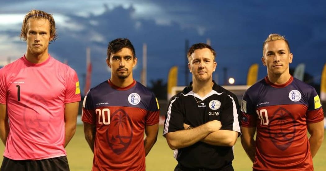 Guam football coach Gary White with some of his players.