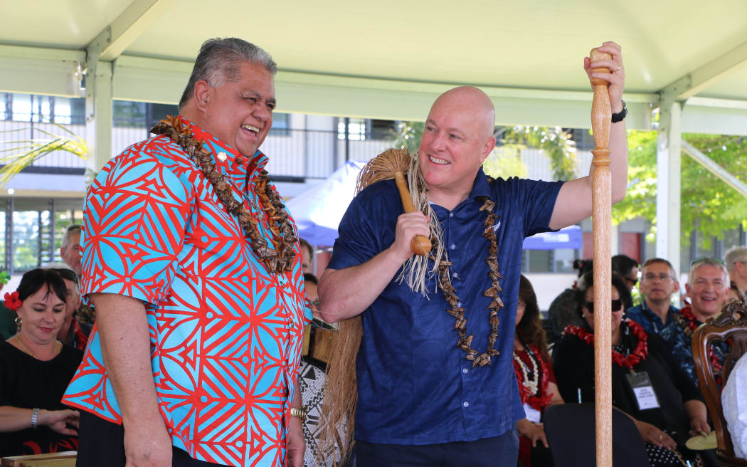 Christopher Luxon and Laʻaulialemalietoa Leuatea Polataivao Fosi Schmidt attend a gift giving ceremony where they received portraits painted by a local Methodist college.