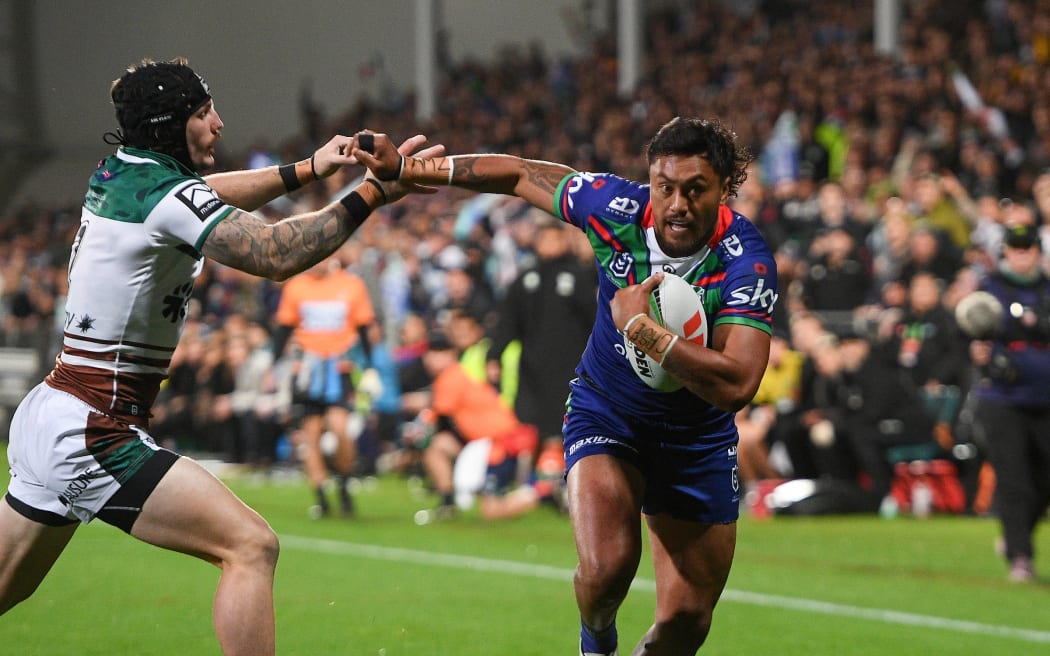Adam Pompey of the Warriors fends off James Schiller of the Knights to go in foe a try during the NRL Telstra Premiership, Warriors Vs Knights at the Apollo Projects Stadium, Christchurch, New Zealand, 25th April 2025. Copyright photo: John Davidson / www.photosport.nz