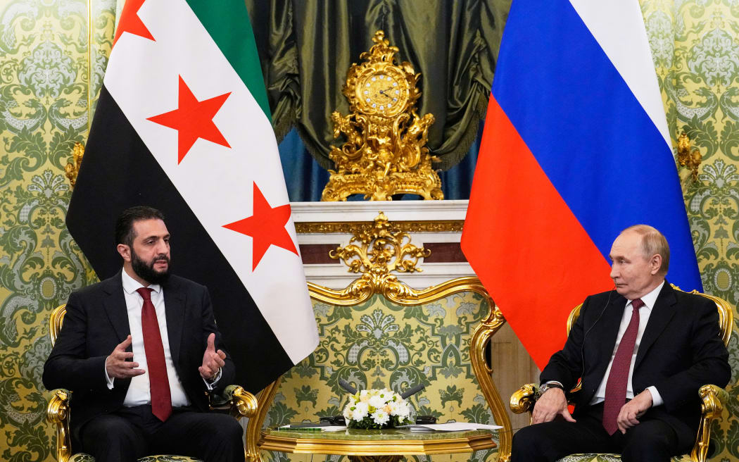 Russian President Vladimir Putin and Syrian interim president Ahmed al-Sharaa hold a meeting at the Grand Kremlin Palace in Moscow on October 15, 2025. (Photo by Alexander Zemlianichenko / POOL / AFP)