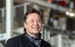 Elon Musk stands in the foundry of the Tesla Gigafactory during a press event in August, 2021.