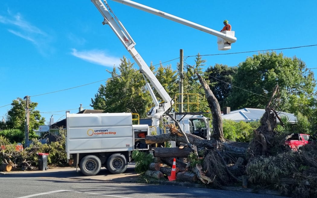 Unison workers fixing power lines in Maraenui, Napier, 20 February 2023.