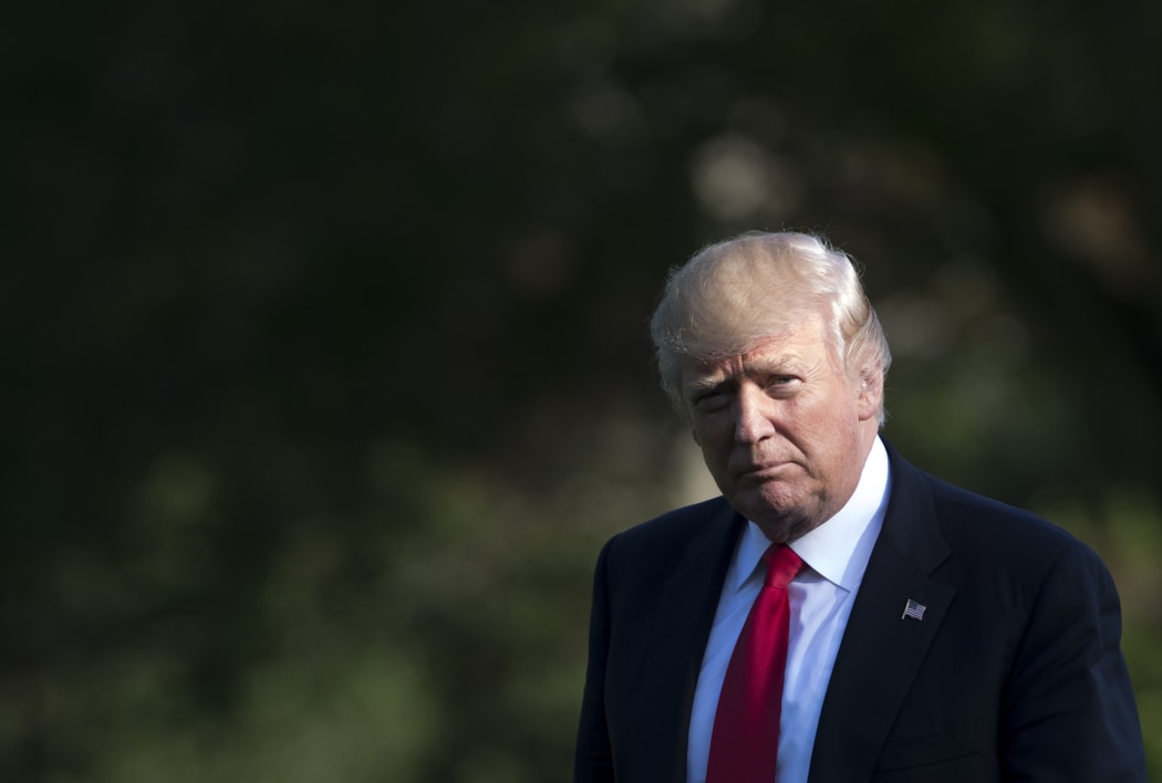 US President Donald Trump after arriving on Marine One on the South Lawn of the White House in Washington, DC, April 28, 2017,