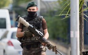A special police officer stands guard during an operation at the Attatürk Airforce Acadamy in Istanbul, Turkey, following the failed coup attempt.