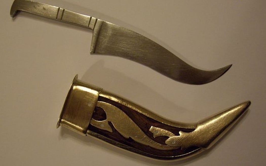 A kirpan and sheath