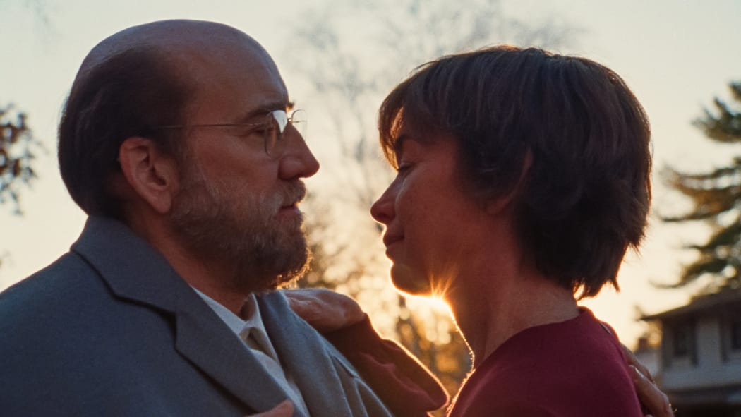 Still from the 2023 black comedy film Dream Scenario featuring Nicolas Cage and Julianne Nicholson.