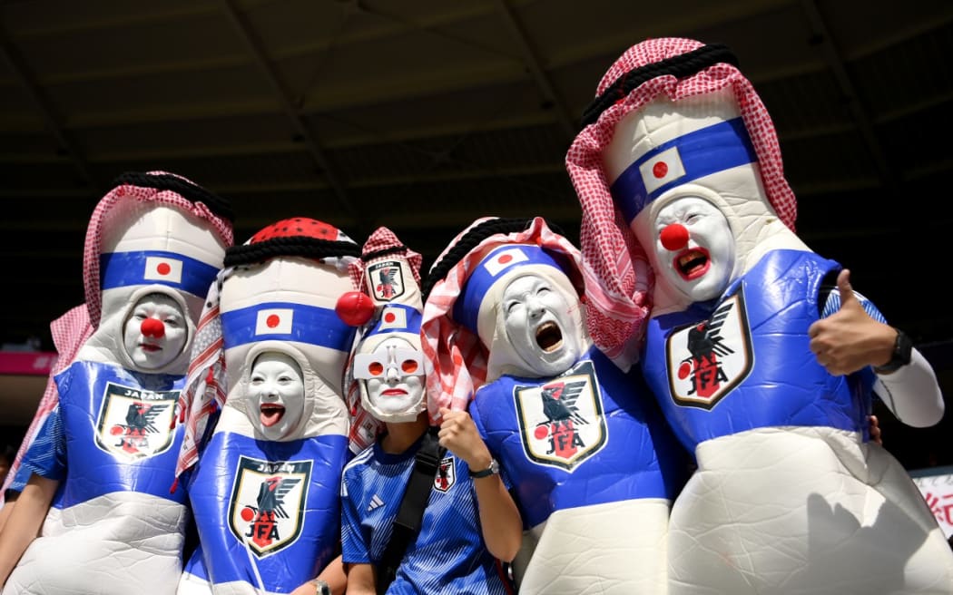 Japanese fans in extravagant costumes at the Qatar FIFA World Cup.
