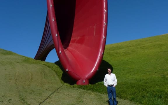Martin Lodge at The Farm sculpture park, Kaipara Harbour, with Dismemberment 1 by Anish Kapoor, 2011