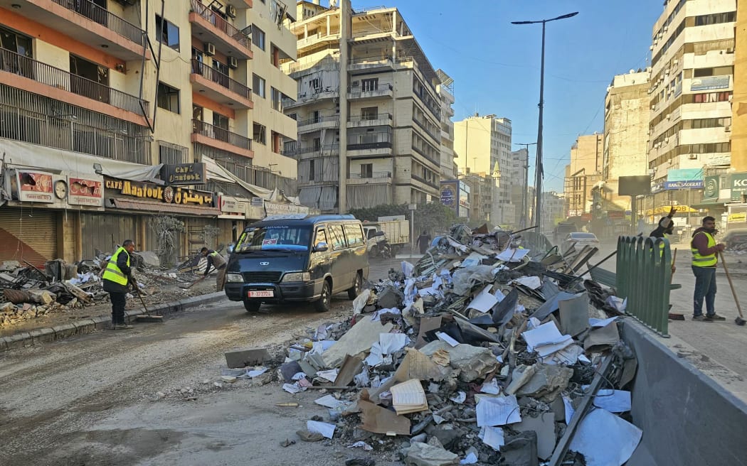 Workers clean the debris from a road of destroyed buildings following airstrikes in Beirut’s southern suburbs of Ghobeiry neighborhood, on March 5, 2026. Israel said it carried out strikes on Beirut targeting Iran-backed militant group Hezbollah on March 5, while Lebanese state media reported an Israeli drone strike killed a Hamas official. (Photo by AFP)