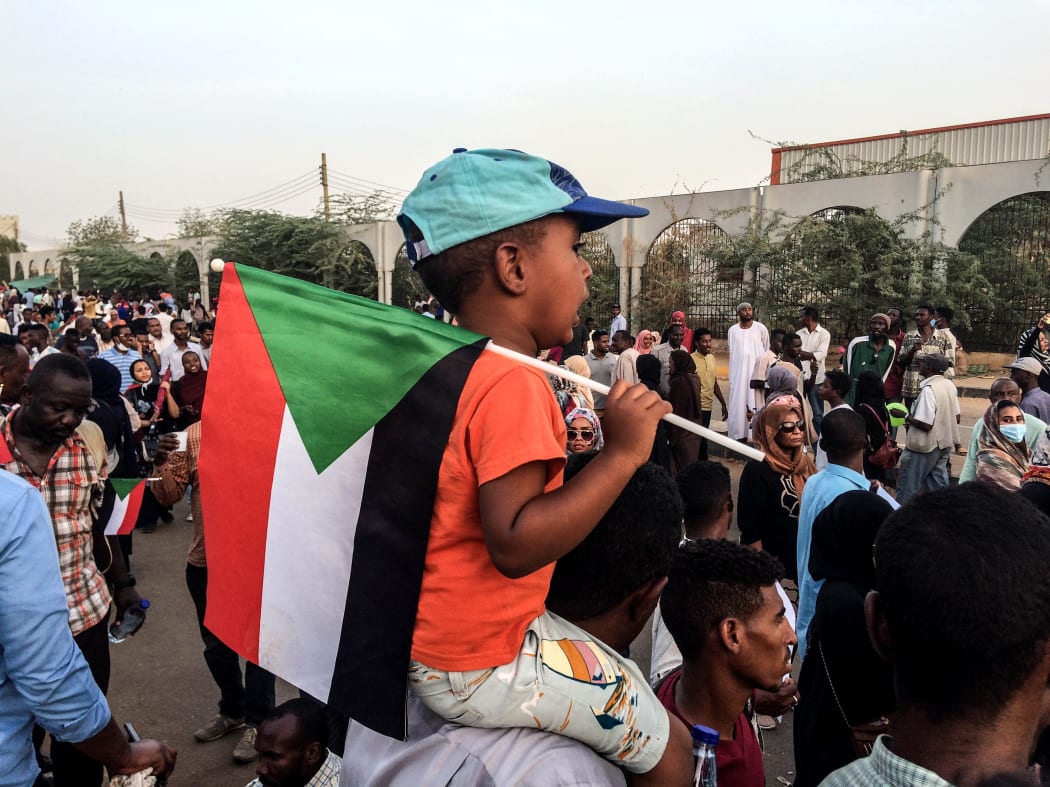 KHARTOUM, SUDAN - APRIL 10: Sudanese protesters, demanding the resignation of Sudanese President Omar Al-Bashir, stage a demonstration against high cost of living, fuel and cash shortage in front of army headquarters building in Khartoum, Sudan.