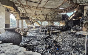 A burned-out interior is seen inside the Birch nightclub following a fire that broke out last midnight, in Goa on December 7, 2025. A  fire that ripped through an Indian nightclub in the popular tourist resort region of Goa killed 25 people, the state's chief minister said on December 7. (Photo by Atish NAIK / AFP)