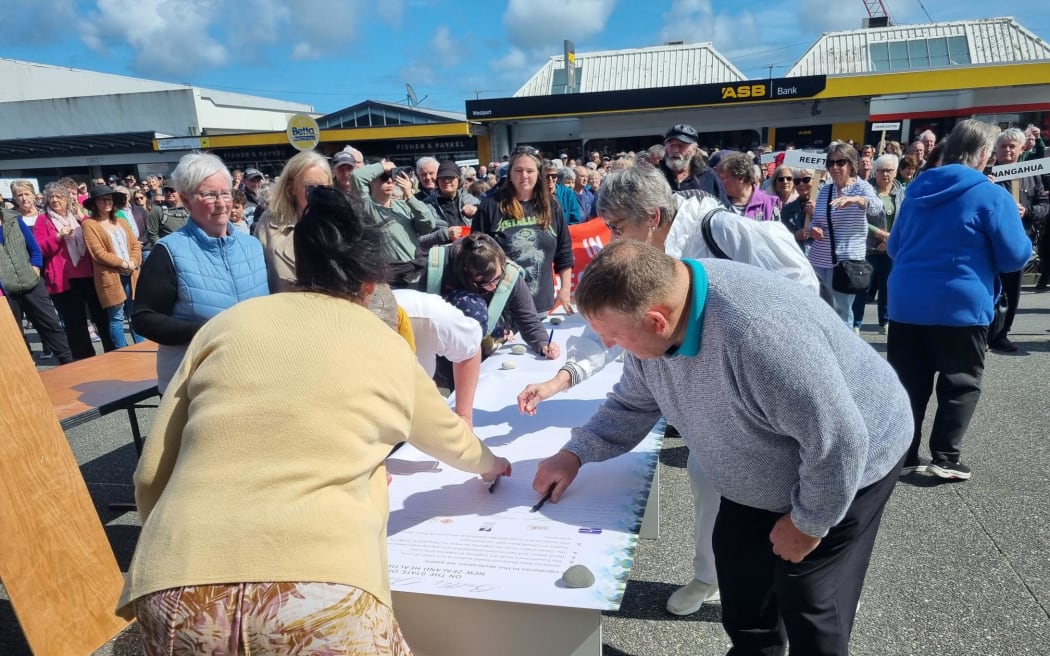 People queue to sign the Buller Declaration in Westport, which calls on the government to fix the crisis in the health system.