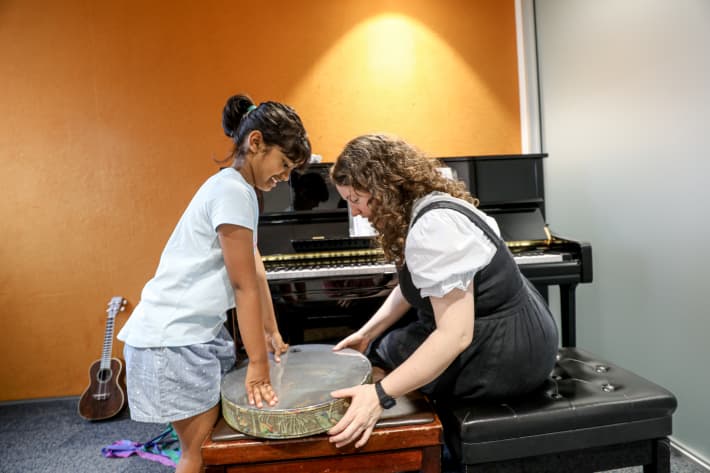 Kiara's music therapist Aliss Pollock has helped her learn about various instruments.