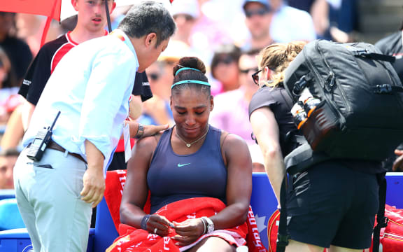 Serena Williams of the United States becomes upset after withdrawing from the final match against Bianca Andreescu of Canada due to a back injury at the Rogers Cup.