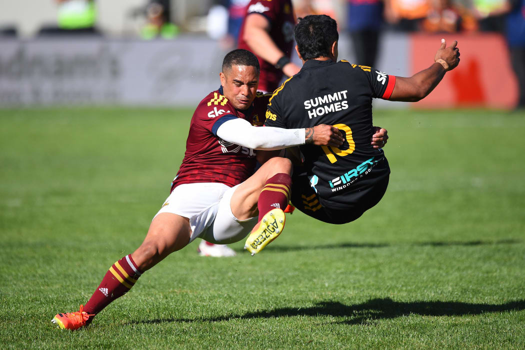 Aaron Smith tackles Josh Ioane in Super Rugby Pacific opener in Queenstown