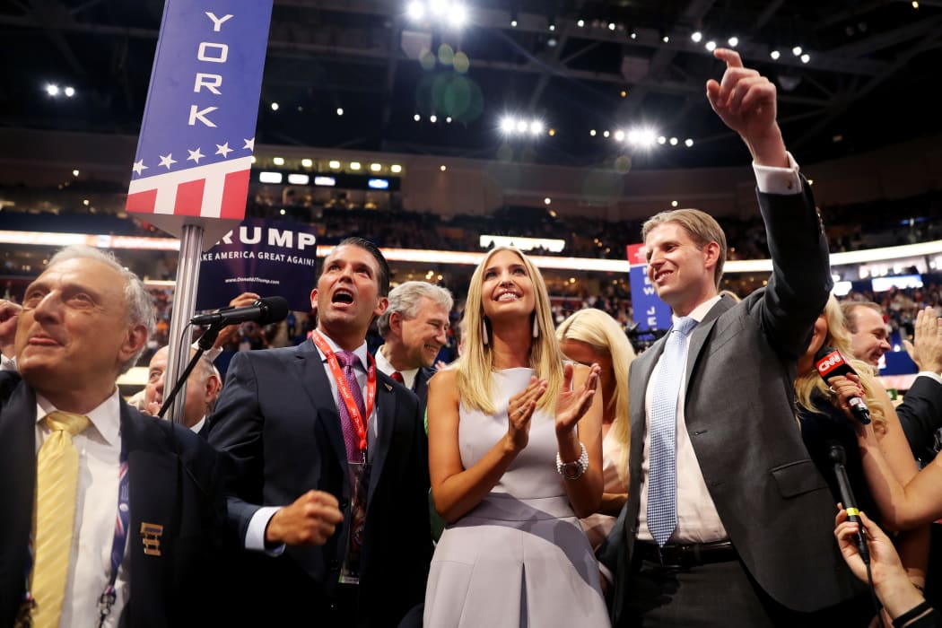 Donald Trump Jr., second left, Ivanka Trump, centre and Eric Trump, right, take part in the roll call at the Republican National  Convention.