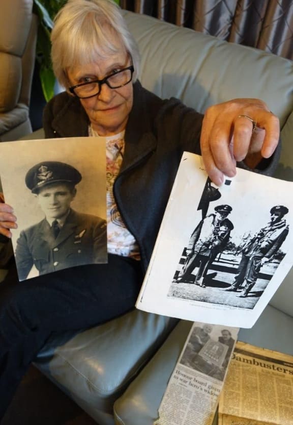 Dianna Lacey with a photo of her father, Flight Lieutenant Leonard Chambers, and the wrongly attributed photo.