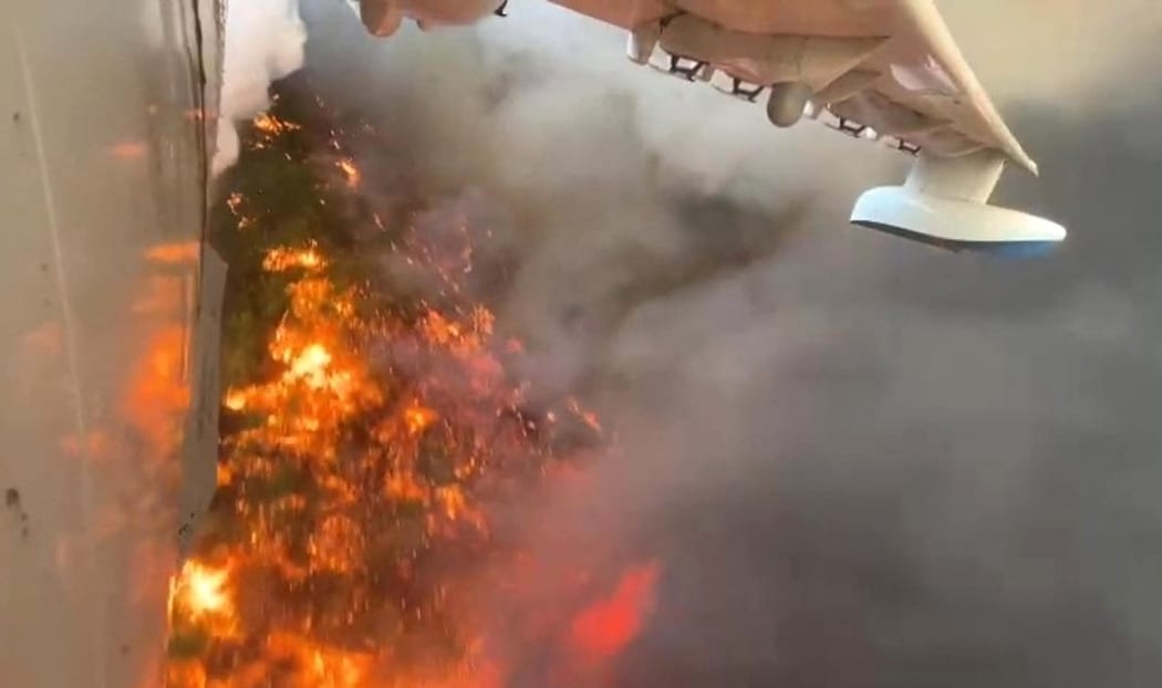 6612062 30.07.2021 In this handout photo released by Rostech press service, a Beriev Be-200 amphibious aircraft extinguishing a forest fire in Antalya, Turkey.
