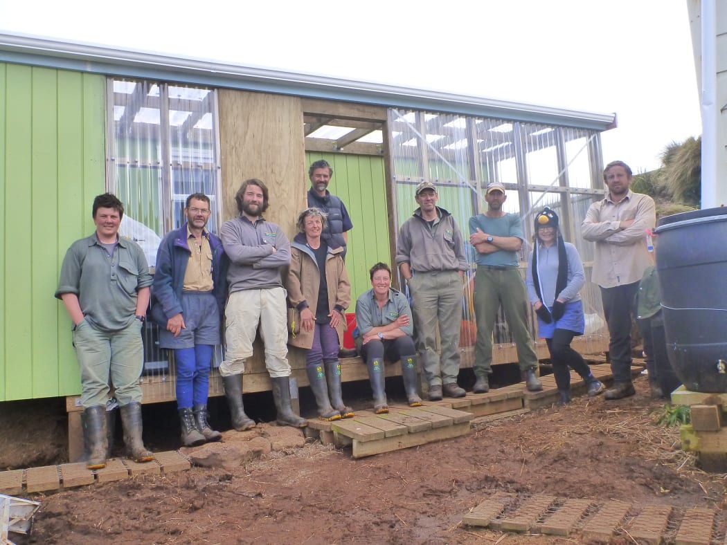 The 2014 Antipodes Island spring expedition in front of the re-built hut.