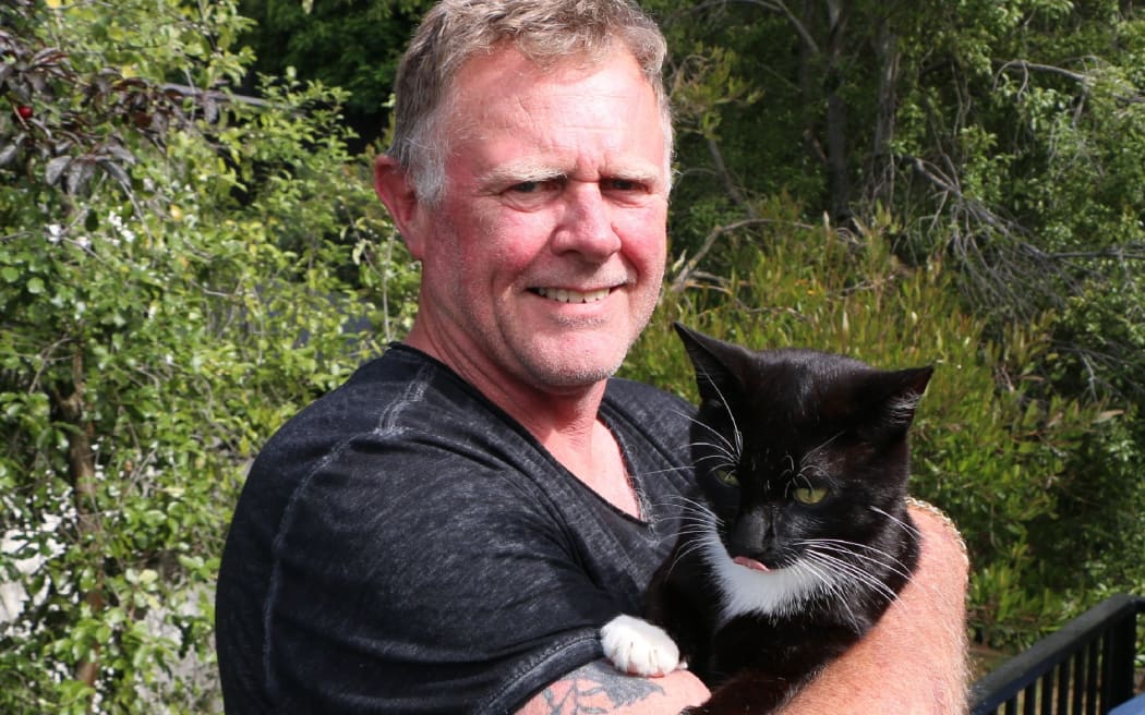 Henry the cat and Greg Johns.