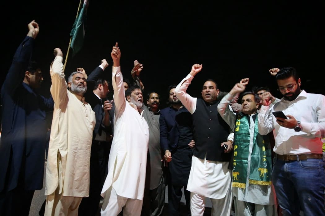 ISLAMABAD, PAKISTAN - APRIL 7: Supporters of opposition parties celebrate after Pakistanâs top court set aside the deputy speaker's ruling to Prime Minister Imran Khan and the house of parliament, in Islamabad, Pakistan on April 7, 2022.