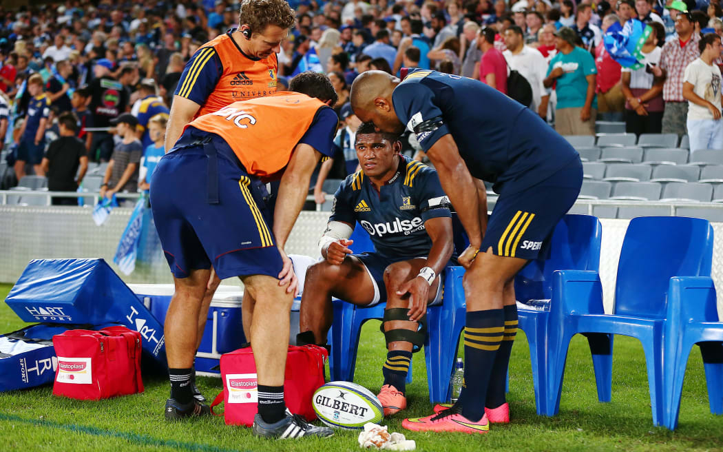 Highlanders winger Waisake Naholo receives treatment after suffering his leg injury.