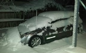 A snow-covered car in Frankton on Monday morning.