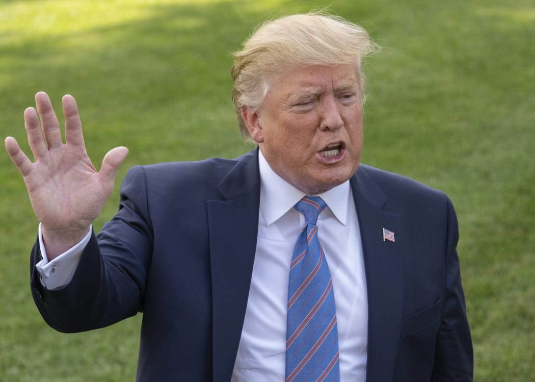 Donald Trump speaks to the media prior to departing the South Lawn of the White House in Washington, DC for a weekend trip to the Trump National Golf Club in Bedminster, New Jersey, 2 August 2019.
