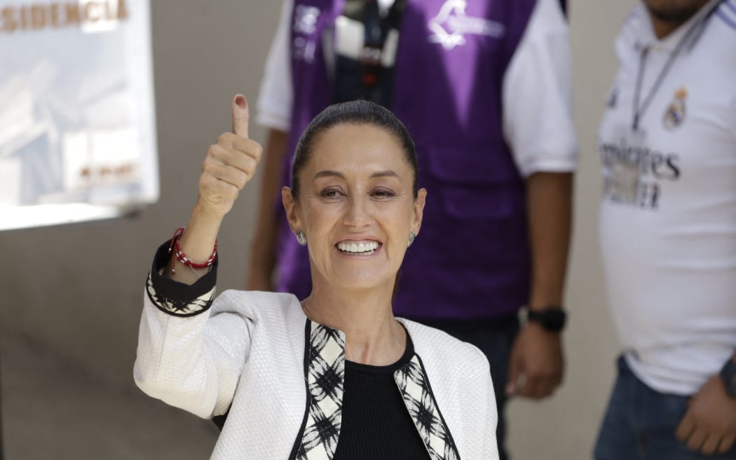 Claudia Sheinbaum Pardo, candidate for the Presidency of Mexico by the Sigamos Haciendo Historia coalition, is showing her marked thumb after casting her vote at a polling booth during the general election in Mexico City, Mexico, on June 2, 2024. (Photo by Luis Barron/Eyepix Group) (Photo by Eyepix/NurPhoto) (Photo by Eyepix / NurPhoto / NurPhoto via AFP)