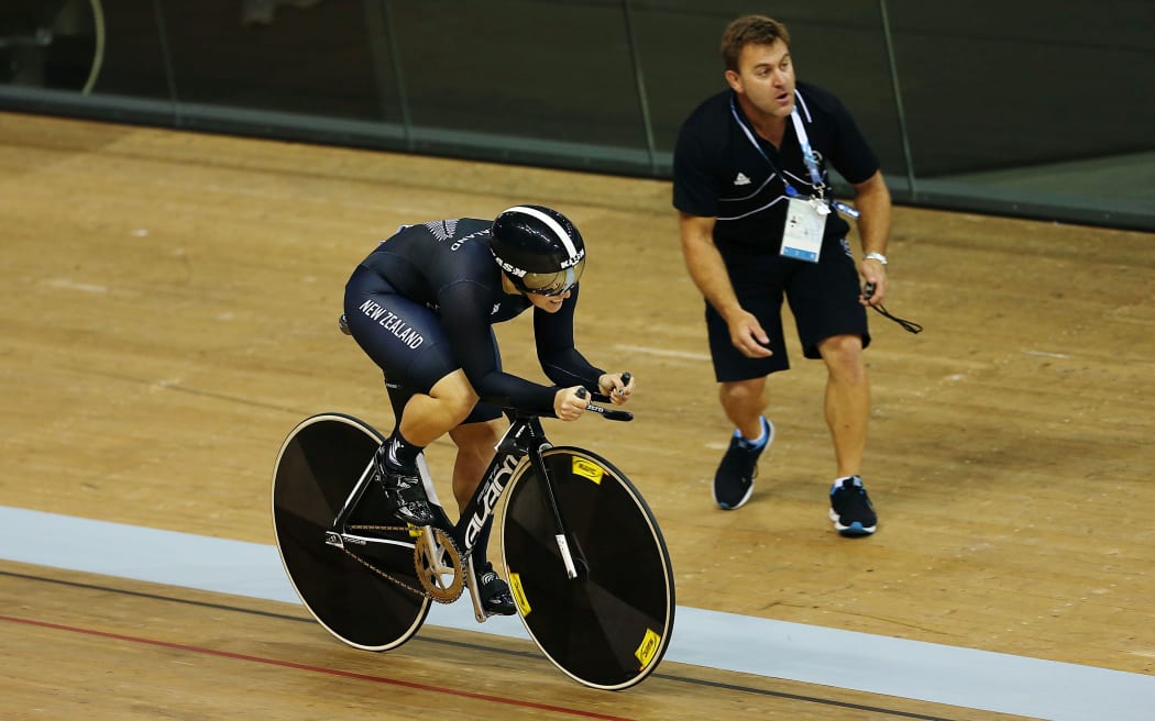Stephanie McKenzie of New Zealand competes during the Women's 500m Time Trial at Glasgow 2014  Commonwealth Games. Coach Anthony Peden watches.