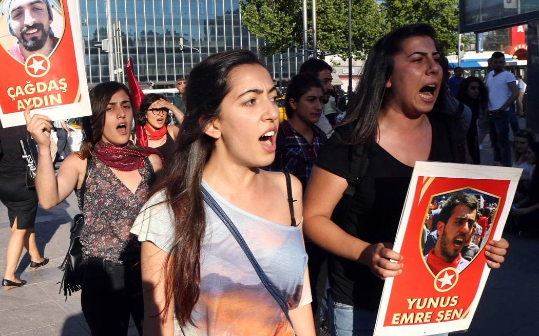 Women protest a suicide bombing that killed 32 activists in the Turkish border town of Suruc.