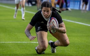 Katelyn Vahaakolo of the Black Ferns scores a try.
