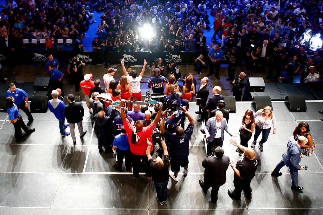 The boxers pose for the crowds following the weigh-in.