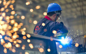 QINGZHOU, CHINA - AUGUST 27, 2023 - A worker welds at a temperature control equipment manufacturing enterprise in Qingzhou Economic Development Zone, East China's Shandong province, Aug. 27, 2023. On the same day, the National Bureau of Statistics released data, from January to July, the total profit of industrial enterprises above designated size in the country was 3,943.98 billion yuan, down 15.5% year-on-year, and the decline was 1.3 percentage points narrower than that in January to June. (Photo by Costfoto/NurPhoto) (Photo by CFOTO / NurPhoto / NurPhoto via AFP)