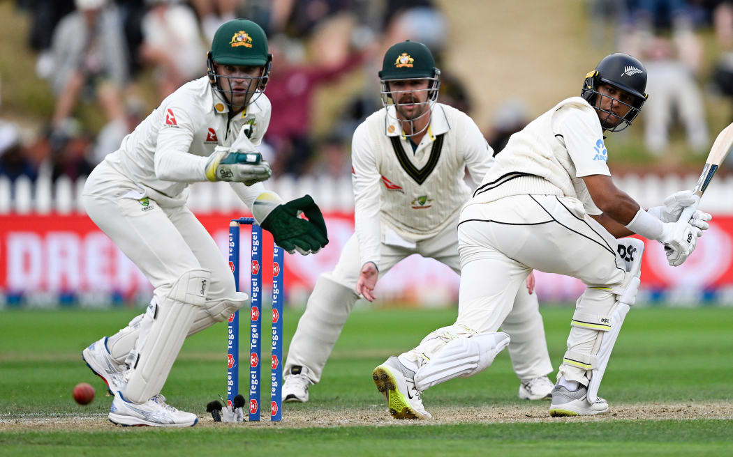 New Zealand's Rachin Ravindra  batting as Australia's Alex Carey and Travis Head look on diring play on Day 3 of the 1st cricket test match between New Zealand and Australia at the Basin Reserve in Wellington, New Zealand, Sat 2 March, 2024. (Andrew Cornaga/Photosport)