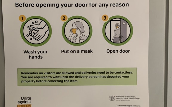 A sign on the door of Sacha Coburn's home during her home isolation trial.