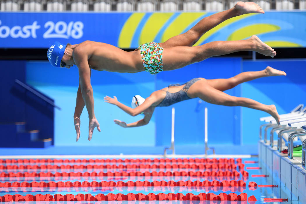 Athletes train in the swimming pool at the Optus Aquatic Centre (GAC), ahead of the 2018 Gold Coast Commonwealth Games, on March 31, 2018. / AFP PHOTO / Anthony WALLACE