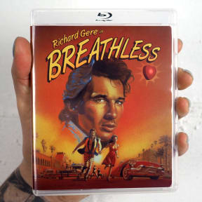 Person holding the cover for the Blu-ray edition of Breathless which is not available in New Zealand.