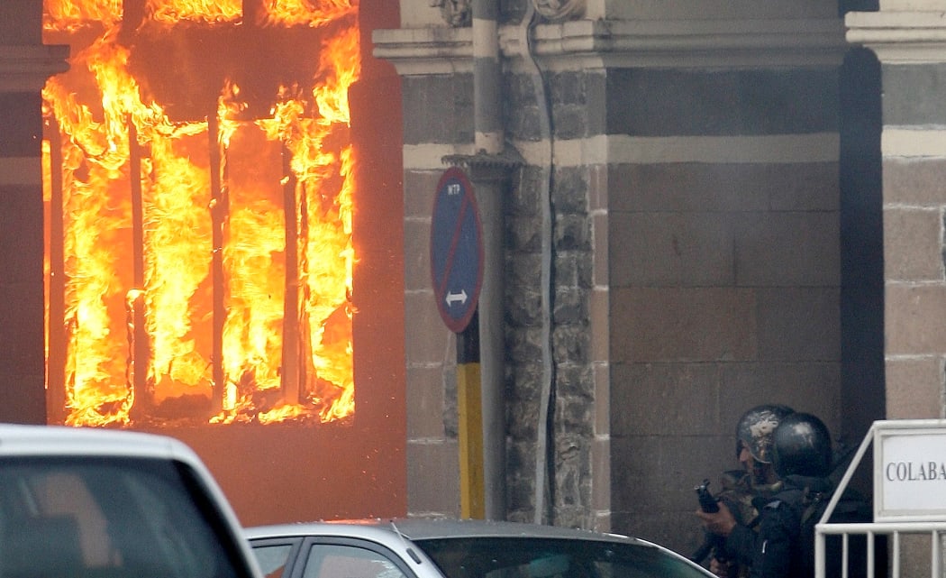 A fire blazes at the Taj Mahal Hotel on 29 November 2008 - one of several sites attacked that month in Mumbai.