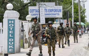 Indian security forces patrol a road near Dal Lake in Srinagar, India, on 6 May, 2025. Increased military presence follows the 22 April attack on tourists in Pahalgam, amid rising tensions between India and Pakistan.