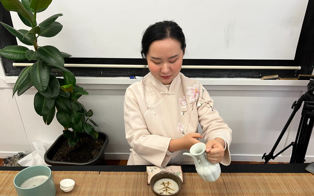 Tiffany Hu demonstrates a traditional Song Dynasty tea ceremony at the festival in Howick.