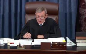 Chief Justice of the United States John G. Roberts, Jr presides as the US Senate considers an amendment to US Senate Resolution 483, during the impeachment trial of US President Donald J Trump.