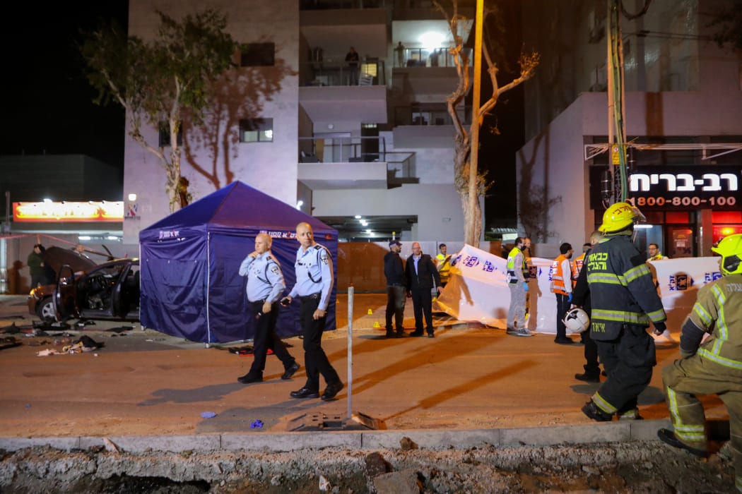 Israeli security forces gather at the site of an attack that left two Israeli police dead in the northern city of Hadera on 27 March 2022.