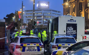 Police in central Auckland the day after the construction site shootings.