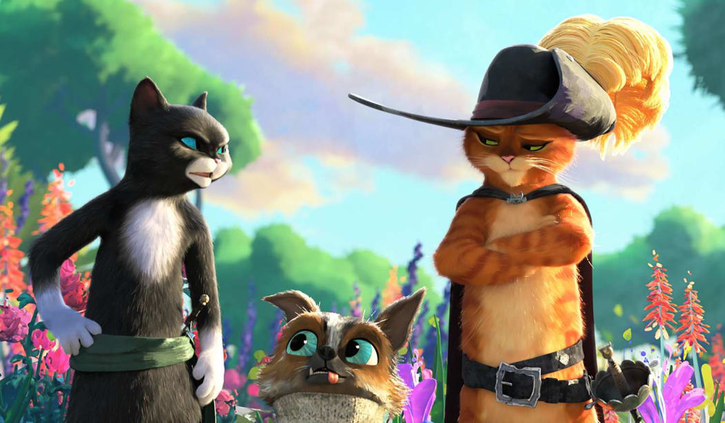 From left to right, Kitty Softpaws, Perrito the chihuahua, and Puss from the film Puss in Boots: The Last Wish